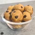 Fuel your day with our healthy chocolate chip protein bites! Made with nutritious ingredients and mini chocolate chips, these bite-sized treats are perfect for a quick energy boost or post-workout snack.